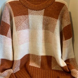 This is A New Day brand sweater. New with original tags and plastic by Target.